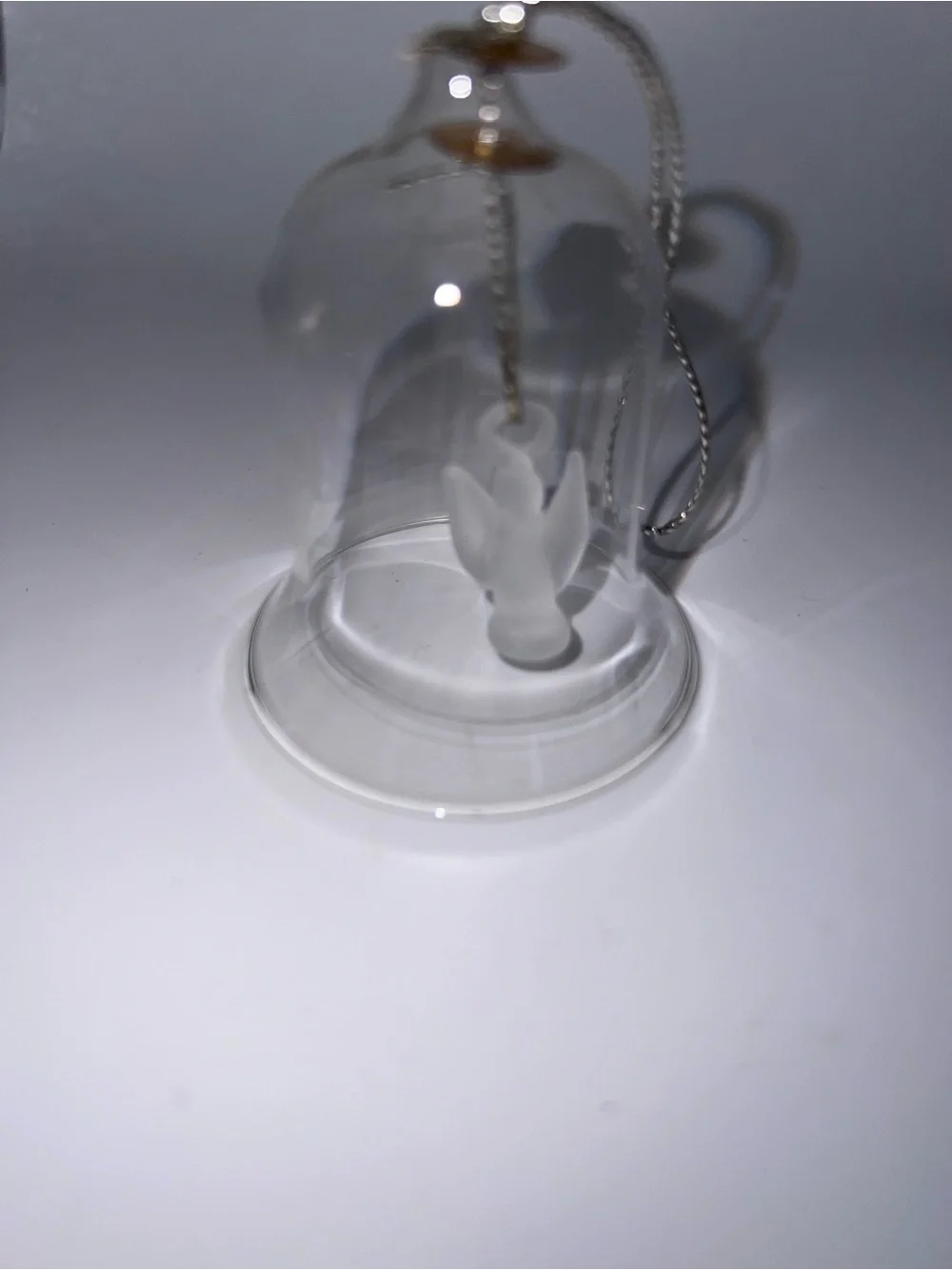 Small glass bell with angel